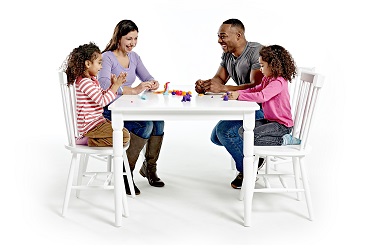 image of family playing a board game